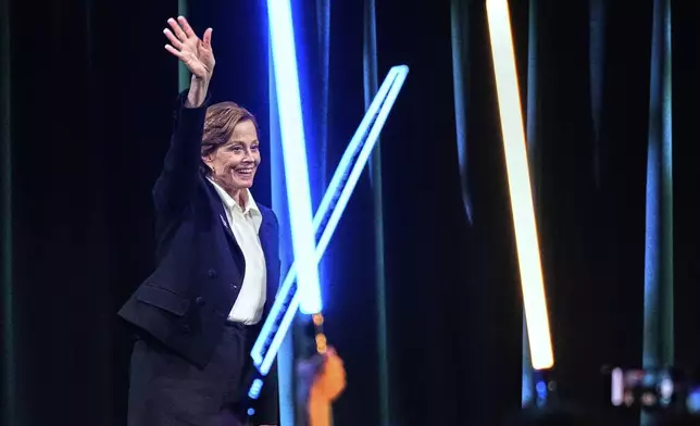 Actor Sigourney Weaver waves to audience members during a fan convention called the Star Wars Celebration Japan in Chiba, near Tokyo, Friday, April 18, 2025. (AP Photo/Hiro Komae)