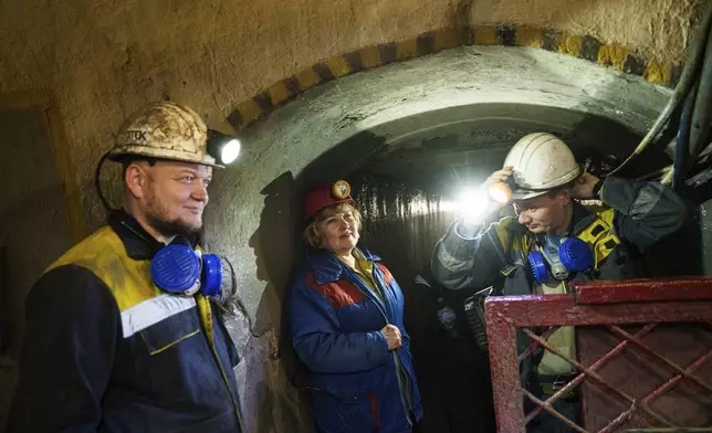 Miners wait for elevator in the tunnel of a coal mine in Dnipropetrovsk region, Ukraine, Jan. 30, 2025. (AP Photo/Evgeniy Maloletka)