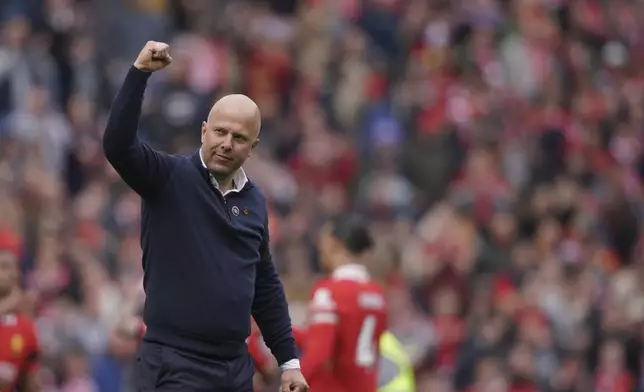 Liverpool's manager Arne Slot celebrates at the end of the English Premier League soccer match between Liverpool and West Ham United at Anfield in Liverpool, Sunday, April 13, 2025. (AP Photo/Ian Hodgson)