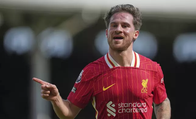 Liverpool's Alexis Mac Allister celebrates after scoring his side's opening goal during the English Premier League soccer match between Fulham and Liverpool, at Craven Cottage, London, Sunday, April 6, 2025. (AP Photo/Kin Cheung)