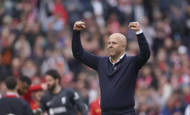 Liverpool's manager Arne Slot celebrates at the end of the English Premier League soccer match between Liverpool and West Ham United at Anfield in Liverpool, Sunday, April 13, 2025. (AP Photo/Ian Hodgson)