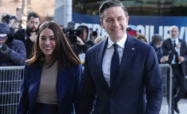 Conservative Leader Pierre Poilievre arrives with his wife Anaida Poilievre, for the English-language federal election debate, in Montreal, Thursday, April 17, 2025. (Chris Young/The Canadian Press via AP)