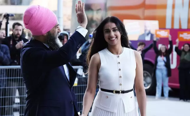 New Democratic Party (NDP) Leader Jagmeet Singh and his wife Gurkiran Kaur Sidhu arrive for the English-language federal election leaders' debate, in Montreal, Thursday, April 17, 2025. (Chris Young/The Canadian Press via AP)