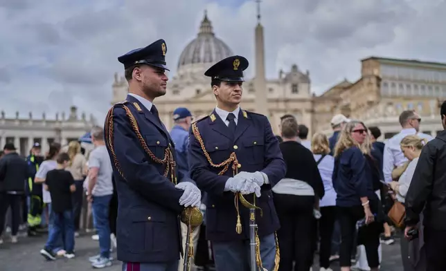 Carabinieri paramilitary police patrol St. Peter's Square as people line up to enter St. Peter's Basilica where Pope Francis is lying in state, at the Vatican, Thursday, April 24, 2025. (AP Photo/Bernat Armangue)