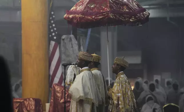Church leaders chant during the hours-long service in the Ge'ez language at Re'ese Adbarat Debre Selam Kidist Mariam Church, an Ethiopian Orthodox Tewahedo church, in Washington, D.C., Saturday, April 5, 2025. (AP Photo/Jessie Wardarski)