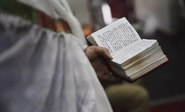 Congregants attend an hours-long service at Re'ese Adbarat Debre Selam Kidist Mariam Church, an Ethiopian Orthodox Tewahedo church, in Washington, D.C., Saturday, April 5, 2025. (AP Photo/Jessie Wardarski)
