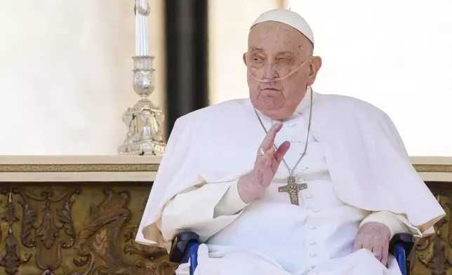 FILE - Pope Francis arrives in a wheelchair at the end of a mass in St. Peter's Square at The Vatican, Sunday, April 6, 2025, part of the Jubilee of the sick and the health workers. (AP Photo/Andrew Medichini, File)