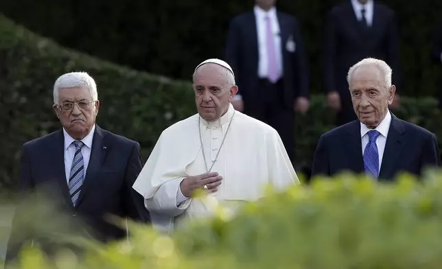 FILE - Pope Francis is flanked by Israel's President Shimon Peres, right, and Palestinian President Mahmoud Abbas during an evening of peace prayers in the Vatican, Sunday, June 8, 2014. (AP Photo/Gregorio Borgia, file)
