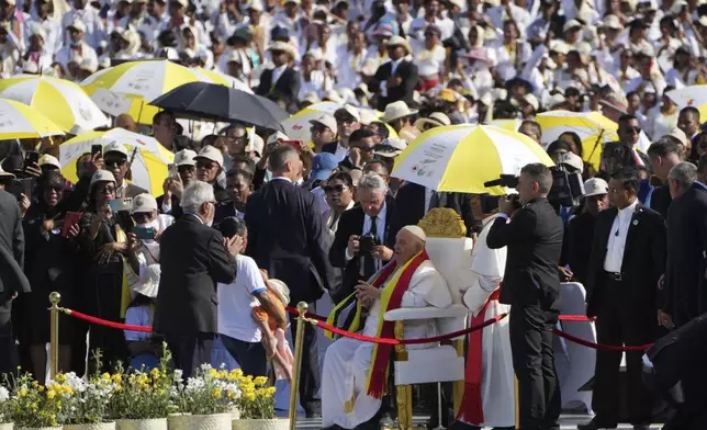 FILE - Pope Francis is seated before leading a holy mass at Tasitolu park in Dili, East Timor, Tuesday, Sept. 10, 2024. (AP Photo/Firdia Lisnawati, file)