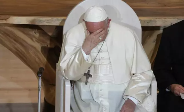 FILE - Pope Francis sits during a meeting with Indigenous peoples and members of the parish community of Sacred Heart in Edmonton, Canada, Monday, July 25, 2022. (AP Photo/Gregorio Borgia, File)