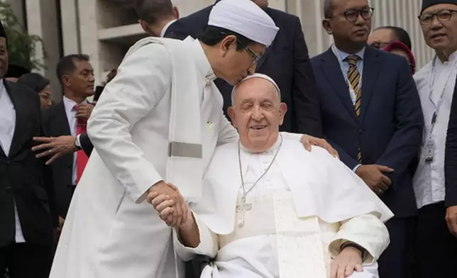 FILE - The Grand Imam Nasaruddin Umar, left, bids farewell to Pope Francis, as he leaves after signing the "Joint Declaration of Istiqlal 2024" at the Istiqlal Mosque in Jakarta, Thursday, Sept. 5, 2024. (AP Photo/Gregorio Borgia, File)