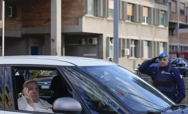 FILE - Pope Francis leaves the Rebibbia Prison where he symbolically opened a Holy Door with inmates in Rome, Thursday, Dec. 26, 2024. (AP Photo/Gregorio Borgia, file)