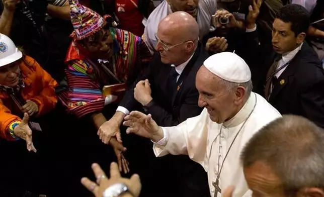 FILE - Pope Francis walks amid the crowd while leaving the second World Meeting of Popular Movements in Santa Cruz, Bolivia, Thursday, July 9, 2015. (AP Photo/Rodrigo Abd, file)