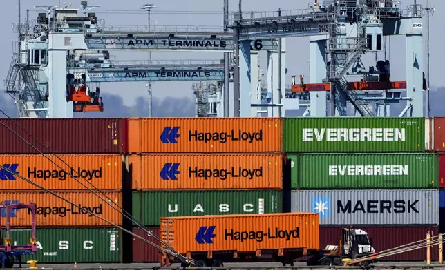 A truck moves a shipping container at the Port Newark Container Terminal, Friday, April 18, 2025, in Newark, N.J. (AP Photo/Julia Demaree Nikhinson)