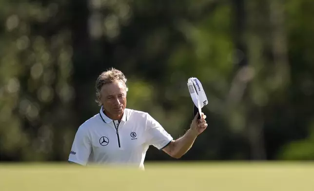 Bernhard Langer, of Germany, waves to the gallery on the 18th green during the second round at the Masters golf tournament, Friday, April 11, 2025, in Augusta, Ga. (AP Photo/George Walker IV)