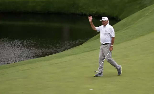 Fred Couples waves after making a putt on the 11th hole during the second round at the Masters golf tournament, Friday, April 11, 2025, in Augusta, Ga. (AP Photo/Ashley Landis)