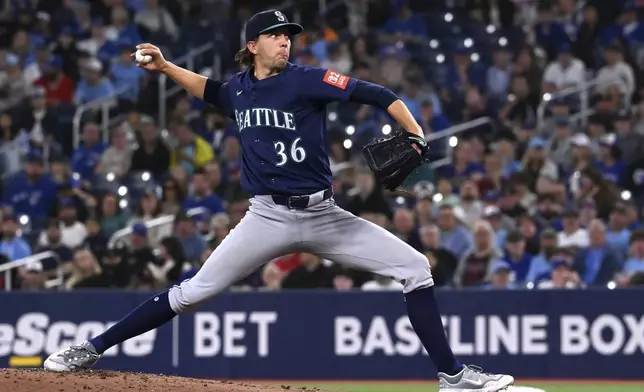 Seattle Mariners starting pitcher Logan Gilbert throws to a Toronto Blue Jays batter in first-inning baseball game action in Toronto, Saturday, April 19, 2025. (Jon Blacker/The Canadian Press via AP)