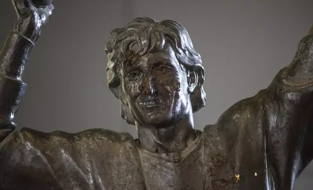 The Wayne Gretzky statue outside of Rogers Place, home of the NHL hockey team Edmonton Oilers, is covered with excrement after it was vandalized, in Edmonton, Alberta, Friday March 21, 2025. (Jason Franson/The Canadian Press via AP)