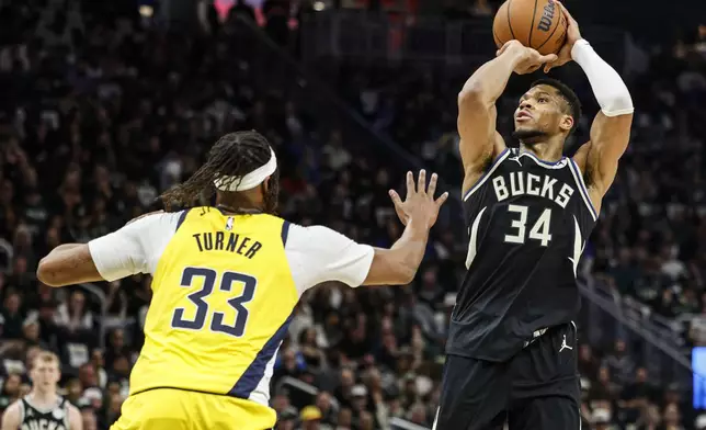 Milwaukee Bucks' Giannis Antetokounmpo (34) shoots against the Indiana Pacers' Myles Turner during the first half of Game 4 of a first-round NBA basketball playoff series Sunday, April 27, 2025, in Milwaukee. (AP Photo/Jeffrey Phelps)