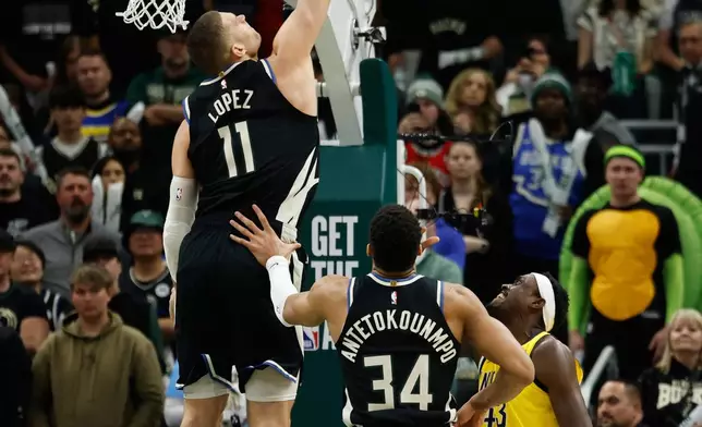 Milwaukee Bucks' Brook Lopez (11) blocks the shot by Indiana Pacers' Pascal Siakam during the first half of Game 4 of a first-round NBA basketball playoff series Sunday, April 27, 2025, in Milwaukee. (AP Photo/Jeffrey Phelps)