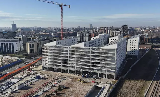 The Olympic village for the Milan Cortina 2026 Winter Olympics is under construction, in Milan, Italy, Saturday, Jan. 18, 2025. (AP Photo/Luca Bruno)