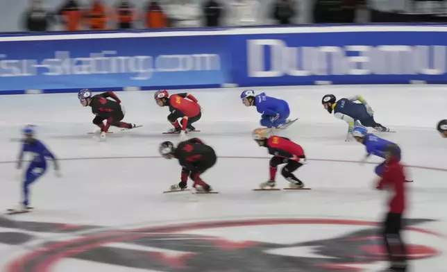 Athletes compete during the women's 500 meters final of the ISU Short Track World Tour and Milan Cortina 2026 Winter Olympics test event, in Milan, Italy, Sunday, Feb. 16, 2025. (AP Photo/Luca Bruno)