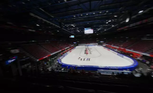 Athletes compete during the Women's 1500 mt. quarterfinal race of the ISU Short Track World Tour, Milan Cortina 2026 Winter Olympics test event, in Milan, Italy, Friday, Feb. 14, 2025. (AP Photo/Luca Bruno)