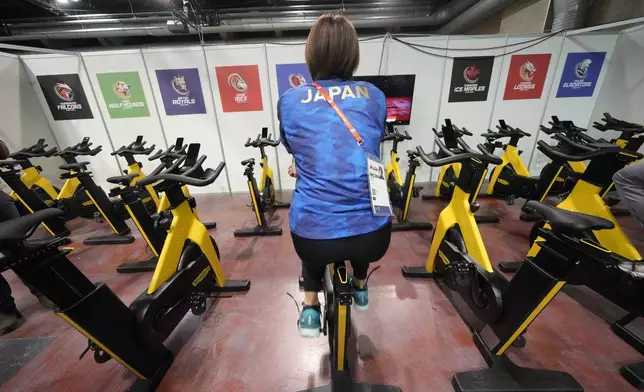 Japan's Ami Hirai warms up in the backstage prior to compete during the ISU Short Track World Tour and Olympics Milano-Cortina 2026 test event at the the Assago Forum, in Assago near Milan, which will be the Milano Ice Skating Arena where figure skating and short track speed skating disciplines of the Milan Cortina 2026 Winter Olympics will take place, Saturday, Feb. 15, 2025. (AP Photo/Luca Bruno)