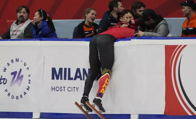 China's Long Sun celebrates after winning the gold medal in the men's 500 meters final of the ISU Short Track World Tour and Milan Cortina 2026 Winter Olympics test event, in Milan, Italy, Saturday, Feb. 15, 2025. (AP Photo/Luca Bruno)