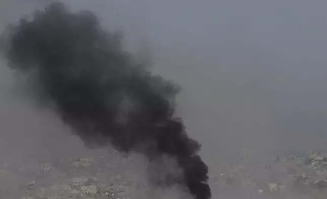 Smoke rises to the sky in the Gaza Strip as seen from southern Israel, Wednesday, April 30, 2025. (AP Photo/Ohad Zwigenberg)