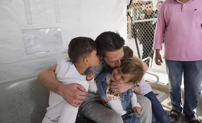 Freed Palestinian prisoner Mohammad Al-Sharif, who was detain by the Israeli army during its ground operation in the Gaza Strip, arrives at al-Aqsa Hospital in Deir al-Balah, central Gaza, after his release from an Israeli prison, Tuesday, April 29, 2025. (AP Photo/Abdel Kareem Hana)