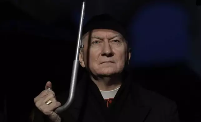 FILE - Vatican Secretary of State Cardinal Pietro Parolin attends a ceremony where the Colosseum is lit up in red to draw attention to the persecution of Christians around the world, in Rome, Saturday, Feb. 24, 2018. (AP Photo/Alessandra Tarantino, File)