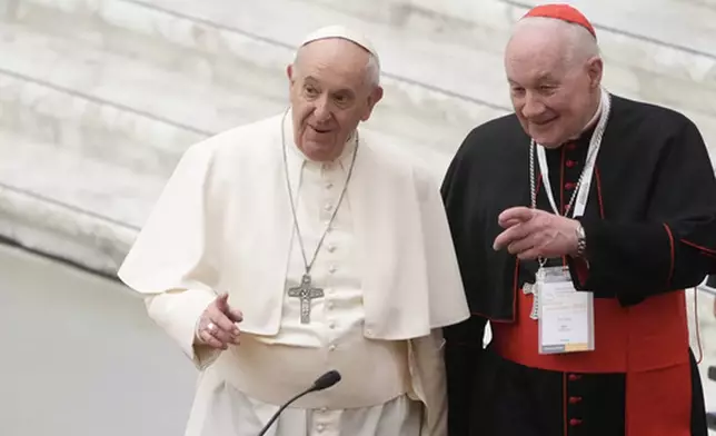 FILE - Pope Francis, left, and Canadian Cardinal Marc Ouellet arrive at the opening of a 3-day Symposium on Vocations in the Paul VI hall at the Vatican, Thursday, Feb. 17, 2022. (AP Photo/Gregorio Borgia, File)