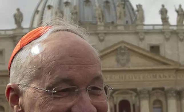 FILE - Canadian Cardinal Marc Ouellet leaves after a meeting at the Vatican, Monday March 11, 2013. (AP Photo/Alessandra Tarantino, File)