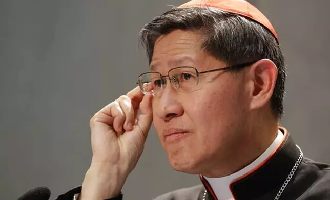 FILE - President of Caritas Internationalis Cardinal Luis Antonio Gokim Tagle makes a point during a press conference announcing the launch of a campaign on the plight of migrants to counteract mounting anti-immigrant sentiment in the U.S., Europe and beyond, at the Vatican press center, Wednesday, Sept. 27, 2017. (AP Photo/Andrew Medichini, File)