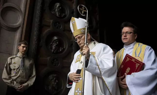 FILE - Cardinal Peter Erdo officiates the Easter Vigil ceremony at the St Stephen's Basilica of Budapest for Easter Vigil services on Saturday, April 8, 2023. (AP Photo/Denes Erdos, File)