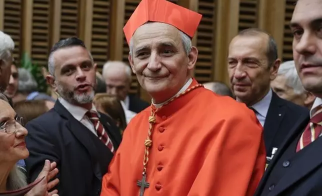 FILE - Cardinal Matteo Zuppi poses for photographers at the Vatican, Saturday, Oct. 5, 2019. (AP Photo/Andrew Medichini, File)