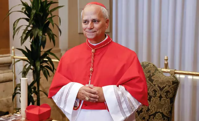 FILE - New Cardinal Robert Francis Prevost, Prefect of the Dicastery for Bishops, poses for a photo at the end of the consistory where Pope Francis elevated 21 new cardinals in St. Peter's Square at the Vatican, Saturday, Sept. 30, 2023. (AP Photo/Riccardo De Luca, file)