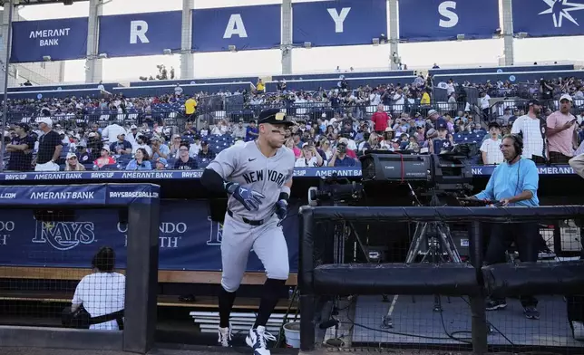 New York Yankees' Aaron Judge runs onto the field before a baseball game against the Tampa Bay Rays at George M. Steinbrenner Field Thursday, April 17, 2025, in Tampa, Fla. (AP Photo/Chris O'Meara)