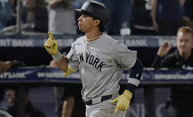 New York Yankees' Oswaldo Cabrera celebrates his solo home run off Tampa Bay Rays pitcher Taj Bradley during the fifth inning of a baseball game Thursday, April 17, 2025, in Tampa, Fla. (AP Photo/Chris O'Meara)
