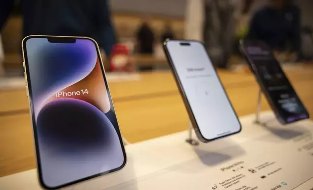 FILE - The iPhone 14, iPhone 14 Pro and iPhone 14 Pro Max are displayed at the Apple Fifth Avenue store, Friday, Sept. 16, 2022, in New York. (AP Photo/Yuki Iwamura, File)