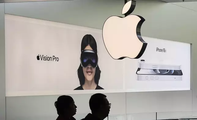Chinese people visit an Apple Store, inside a shopping mall, in Beijing, Thursday, April 10, 2025. (AP Photo/Andy Wong)
