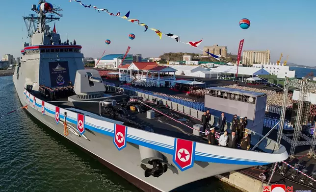 In this photo provided by the North Korean government, its leader Kim Jong Un, second right, and his daughter, third right, seen at bottom right, attend a ceremony to unveil a new naval destroyer at a western port in Nampo a launching ceremony at a western port in Nampo, North Korea, Friday, April 25, 2025. Independent journalists were not given access to cover the event depicted in this image distributed by the North Korean government. The content of this image is as provided and cannot be independently verified. Korean language watermark on image as provided by source reads: "KCNA" which is the abbreviation for Korean Central News Agency. (Korean Central News Agency/Korea News Service via AP)