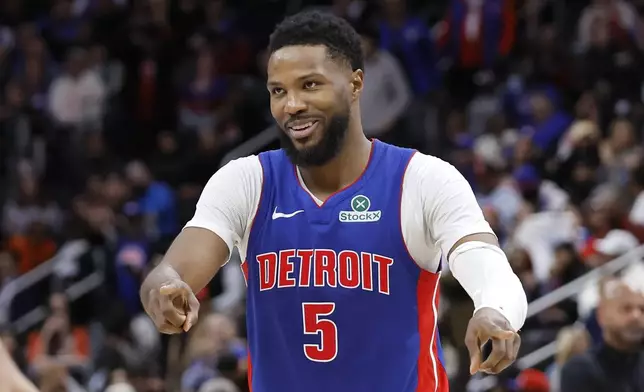 Detroit Pistons guard Malik Beasley jokes with a teammate during the fourth quarter of a win over the New York Knicks in an NBA basketball game Thursday, April 10, 2025, in Detroit. (AP Photo/Duane Burleson)