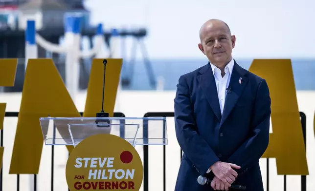 Author and former Fox News host Steve Hilton listens to video presentations as he announced his run for California governor, as a Republican to replace Democrat Gavin Newsom, during an event in Huntington Beach, Calif., Tuesday, April 22, 2025. (Paul Bersebach/The Orange County Register via AP)