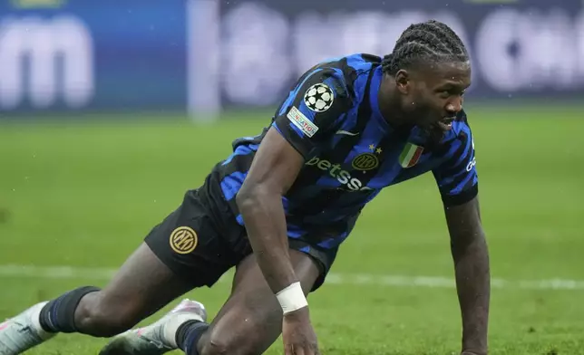 Inter Milan's Marcus Thuram reacts after a missed scoring opportunity during the Champions League quarterfinal second leg soccer match between Inter Milan and Bayern Munich at the San Siro stadium in Milan, Italy, Wednesday, April 16, 2025. (AP Photo/Luca Bruno)