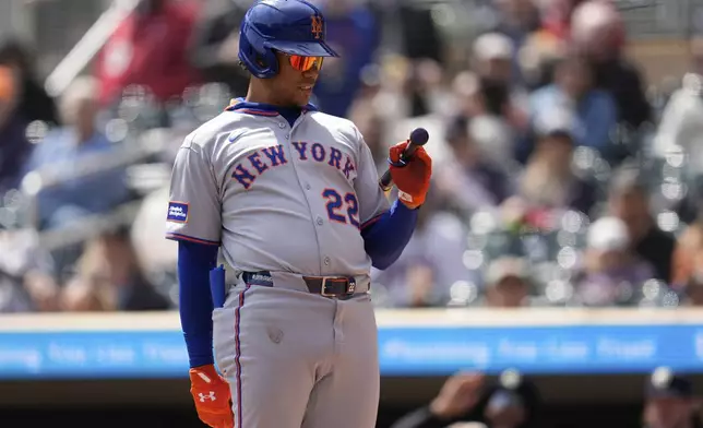 New York Mets' Juan Soto (22) reacts after striking out during the first inning of a baseball game against the Minnesota Twins, Wednesday, April 16, 2025, in Minneapolis. (AP Photo/Abbie Parr)