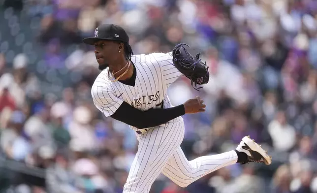 Colorado Rockies relief pitcher Angel Chivilli works against the Washington Nationals in the third inning of Game 1 of a split baseball doubleheader Sunday, April 20, 2025, in Denver. (AP Photo/David Zalubowski)
