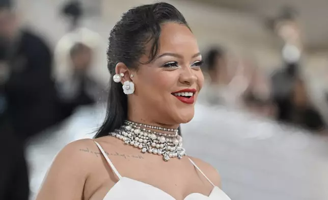 FILE - Rihanna shows off her baby bump at The Metropolitan Museum of Art's Costume Institute benefit gala celebrating the opening of the "Karl Lagerfeld: A Line of Beauty" exhibition on Monday, May 1, 2023, in New York. (Photo by Evan Agostini/Invision/AP, File)