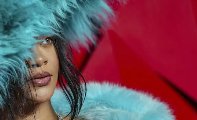 FILE - Rihanna poses for photographers upon arrival at the The Fashion Awards 2024 on Monday, Dec. 2, 2024, in London. (Photo by Scott A Garfitt/Invision/AP, File)